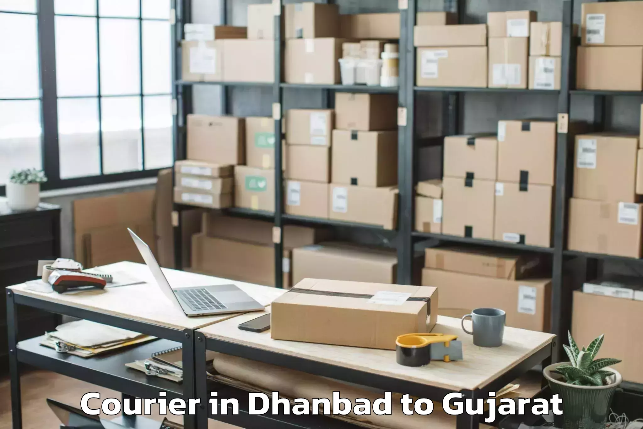 Reliable Dhanbad to Waghai Courier